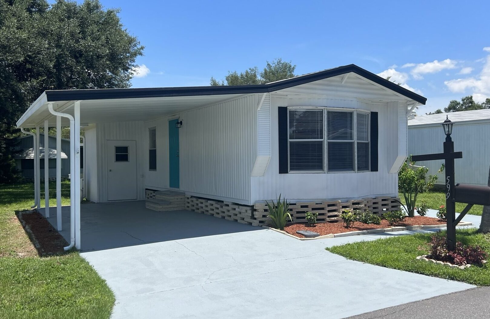 Single wide mobile home in park.